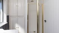 After a day at the beach, step into the invigorating rainfall shower.