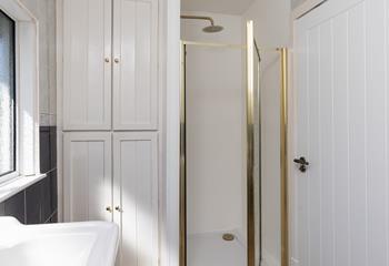 After a day at the beach, step into the invigorating rainfall shower.