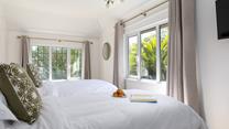 Feel like you're in paradise, waking up to views of sub-tropical flora.