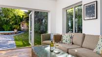 Step from the dining room into the garden, making the most of outdoor living!