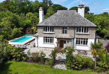 Set within private gardens, this charming retreat is perfect for a family getaway.