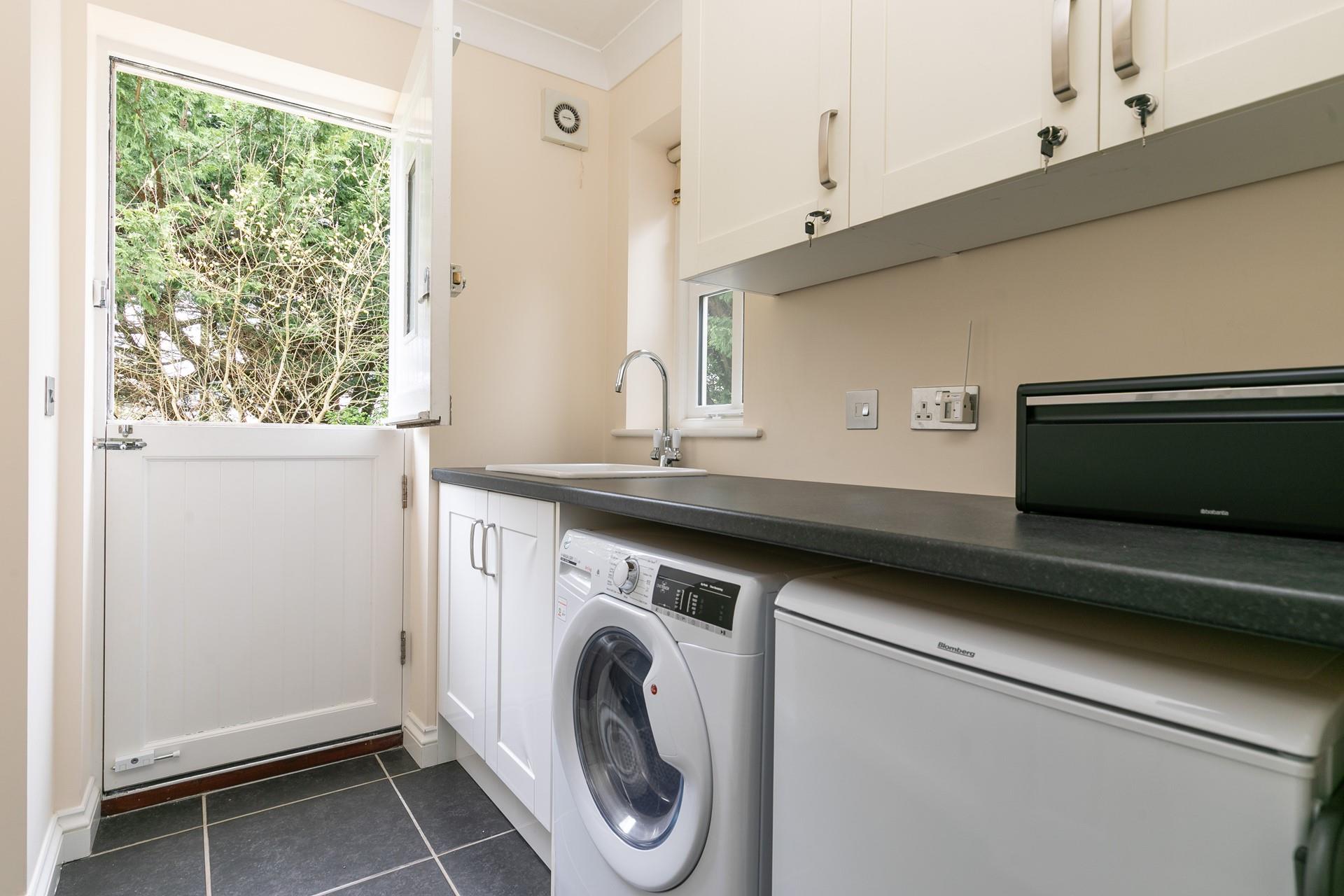 From the garden, you can access the utility room.