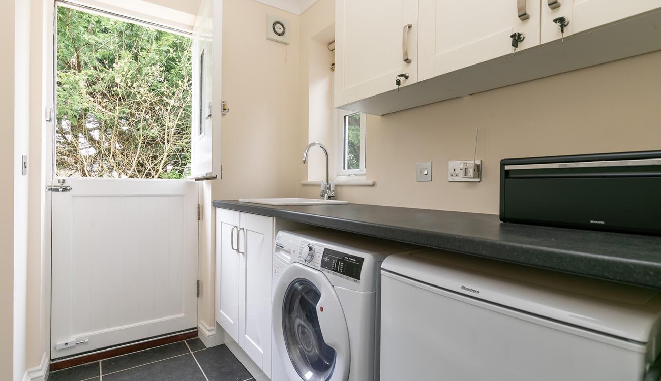 From the garden, you can access the utility room.