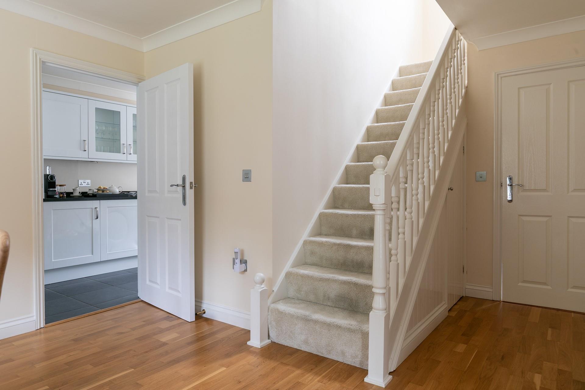 The entryway leads into the dining room, where there's plenty of space fo all the family.