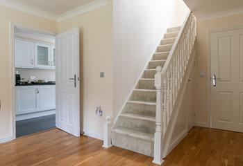 The entryway leads into the dining room, where there's plenty of space fo all the family.