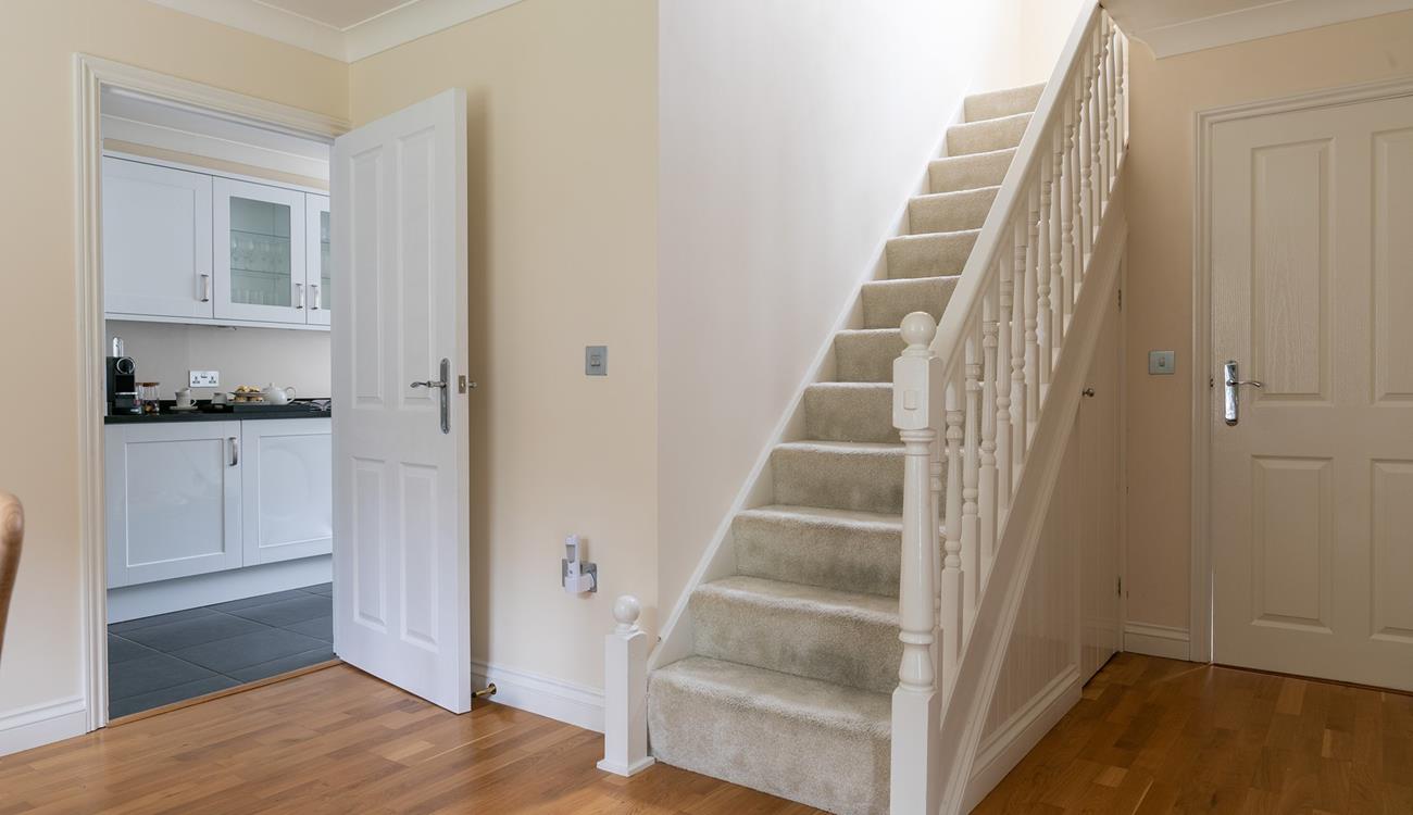 The entryway leads into the dining room, where there's plenty of space for all the family.