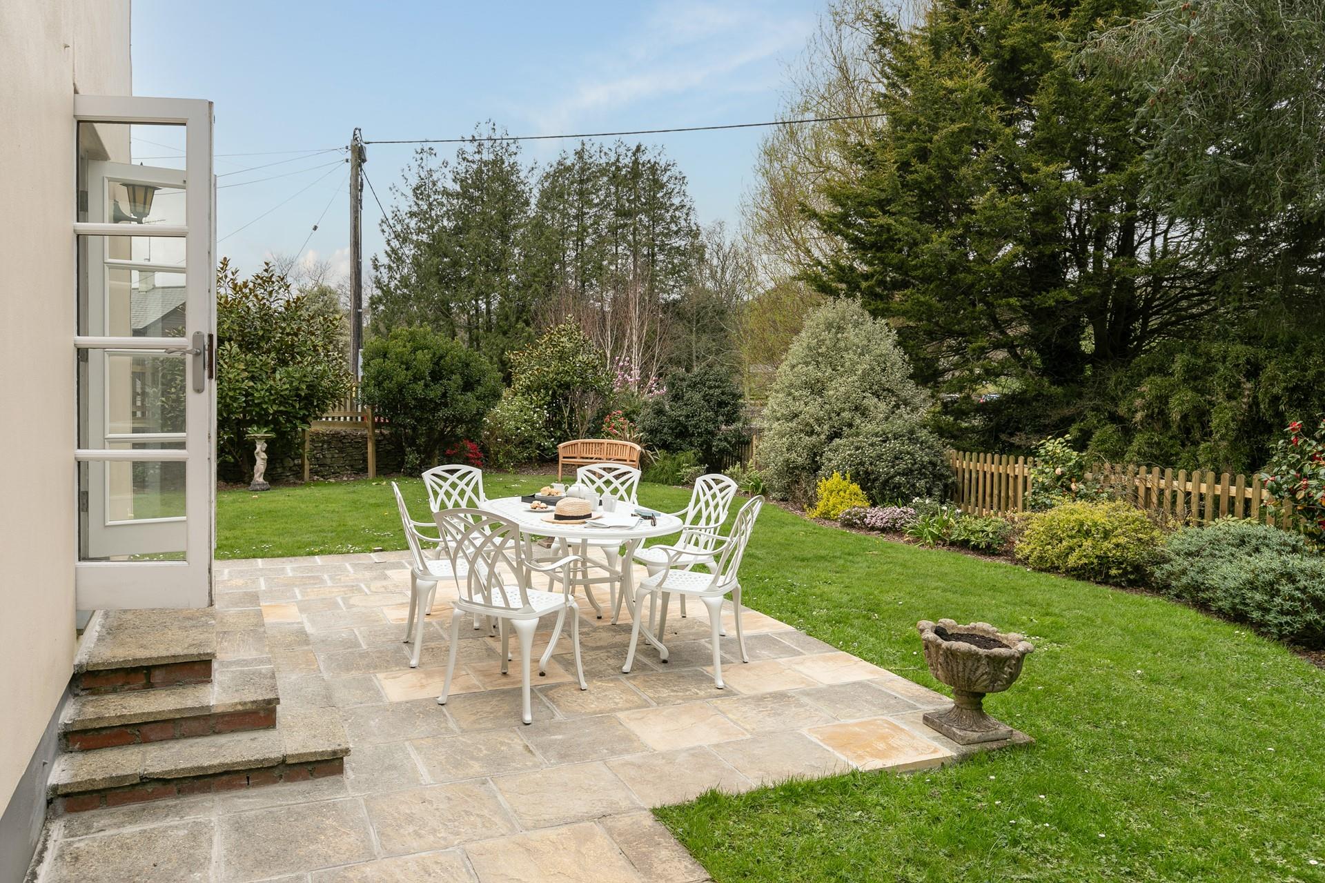 Beautifully manicured, the garden reflects the pretty village location.