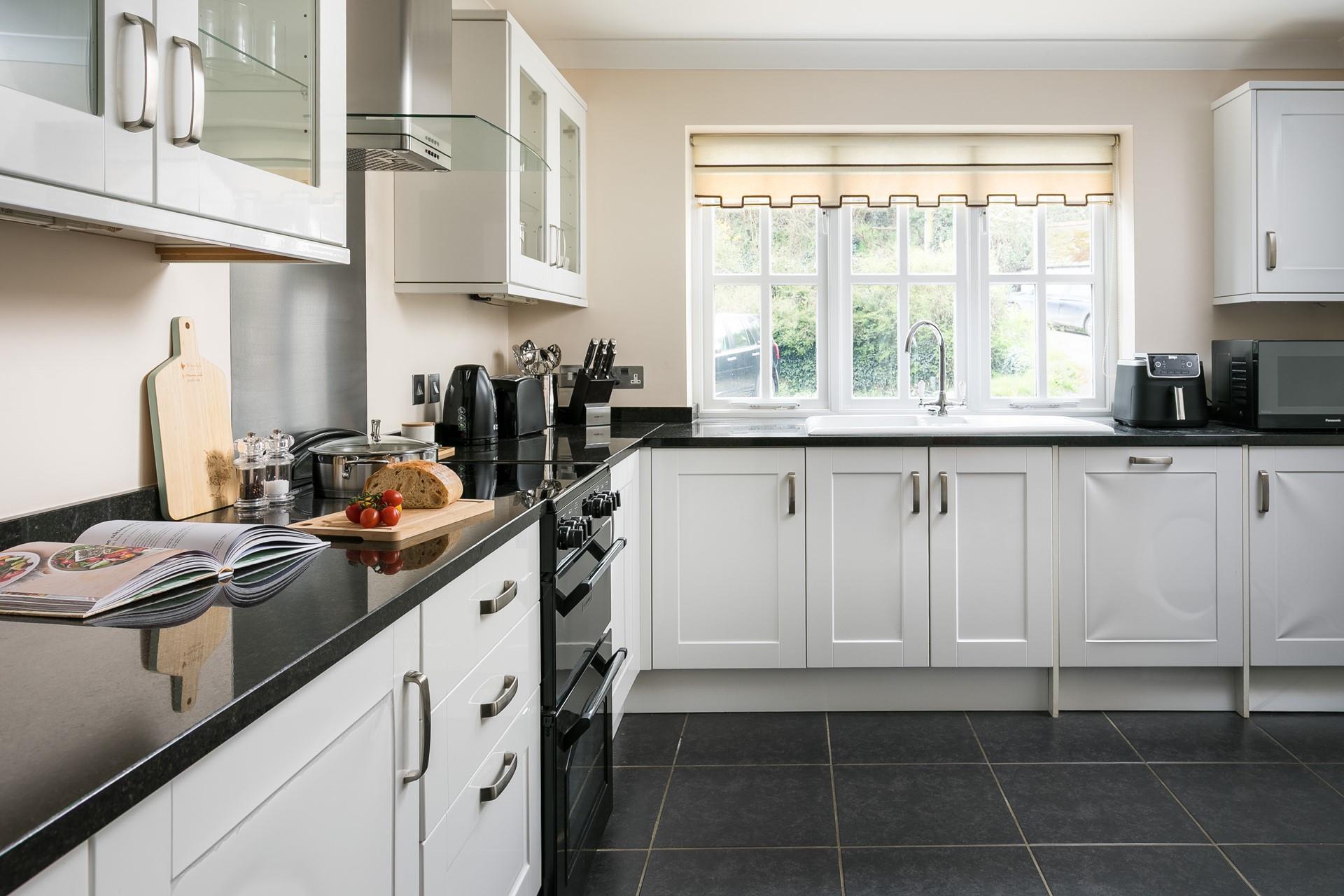 The kitchen has all the amenities you need, including a Nespresso machine, air fryer, and dishwasher!