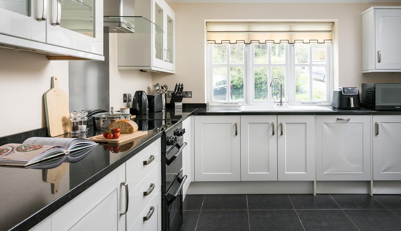 The kitchen has all the amenities you need, including a Nespresso machine, air fryer, and dishwasher!
