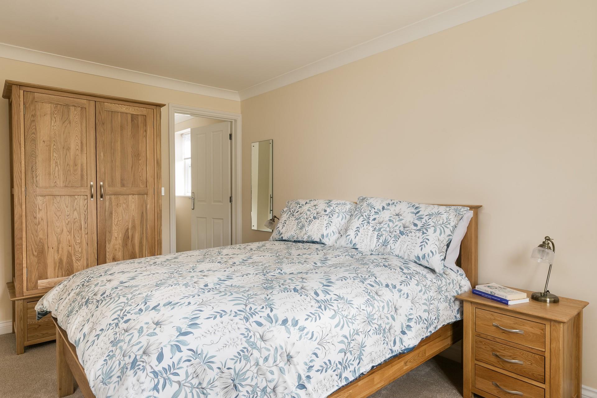 Bedroom 1 is a spacious sanctuary with lots of storage and a comfortable king size bed.