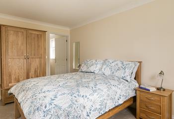 Bedroom 1 is a spacious sanctuary with lots of storage and a comfortable king size bed.