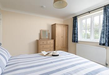 Bedroom 2 is decorated in calming coastal hues.