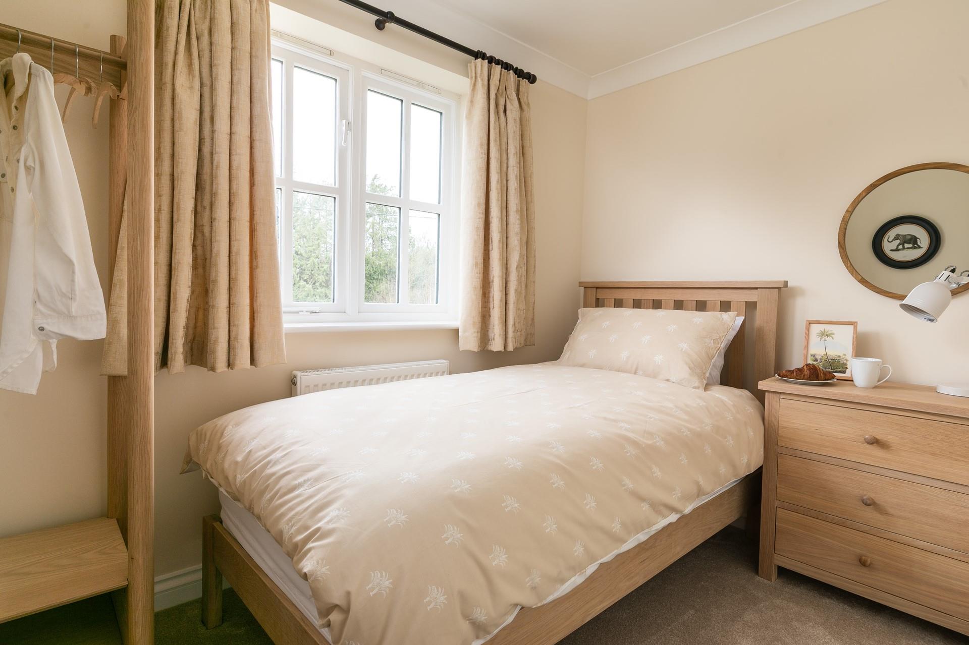 Bedroom 4 is another single, offering flexible sleeping arrangements.