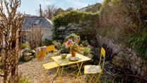 Enjoy sunny mornings and balmy evenings in the quaint garden.
