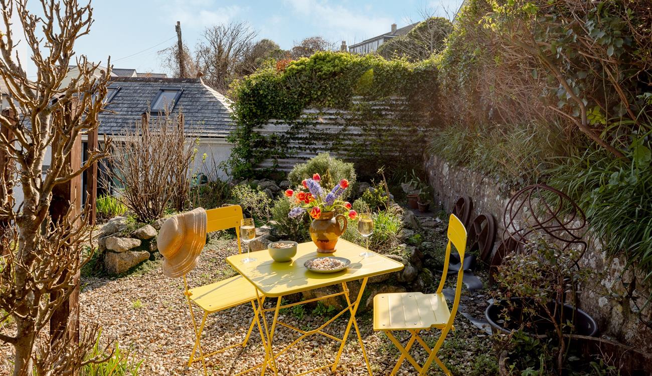 Enjoy sunny mornings and balmy evenings in the quaint garden.