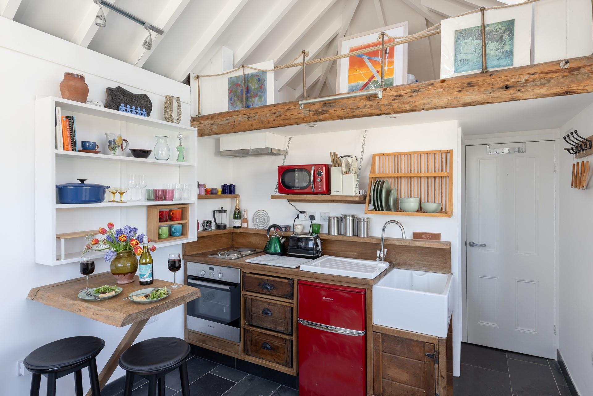 The kitchen area is well-equipped with all the mod cons you need.