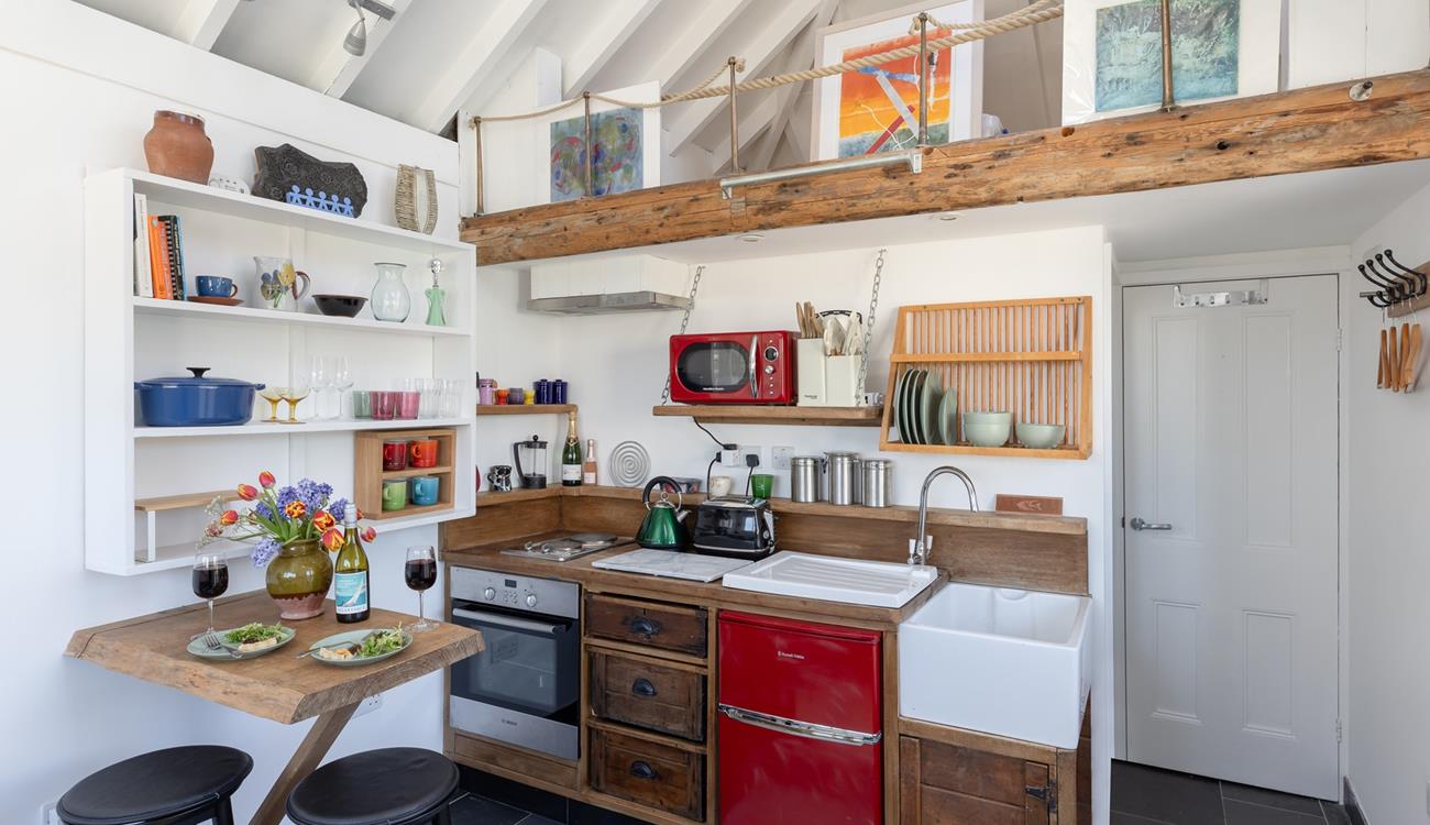 The kitchen area is well-equipped with all the mod cons you need.