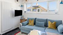 With views across the rooftops and out to sea, The Art House is a quaint coastal studio.