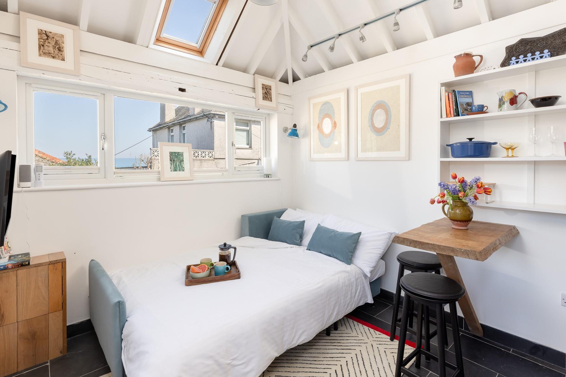 The sofa bed creates a comfortable corner for peaceful nights' sleep.