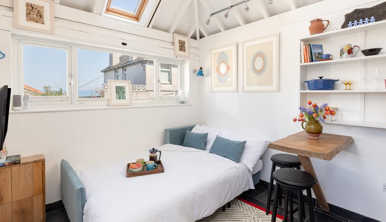 The sofa bed creates a comfortable corner for peaceful nights' sleep.