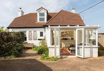 Open the doors and let the summer breeze drift through the house.