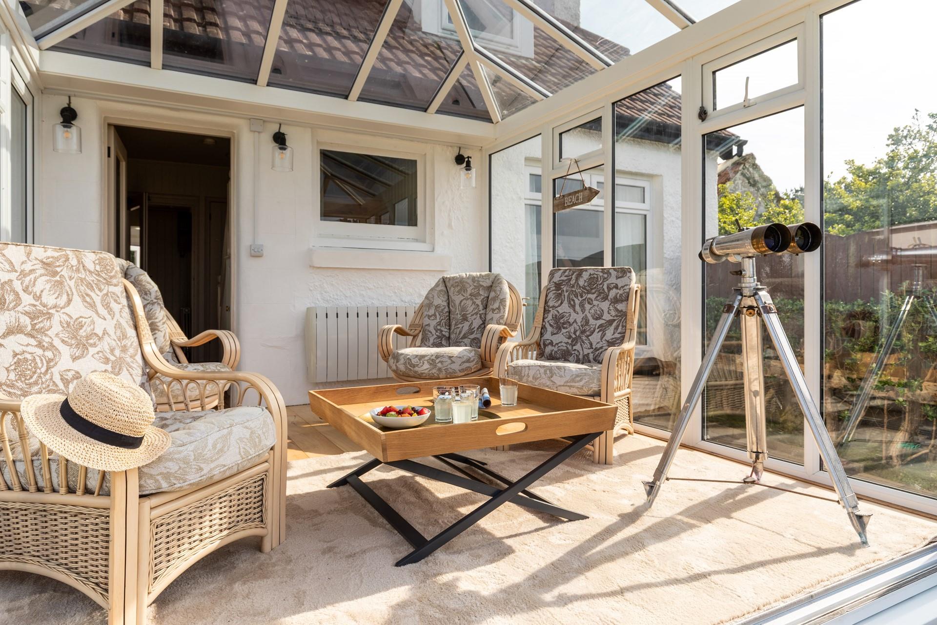 The conservatory is the ideal spot for relaxing and enjoying the view.