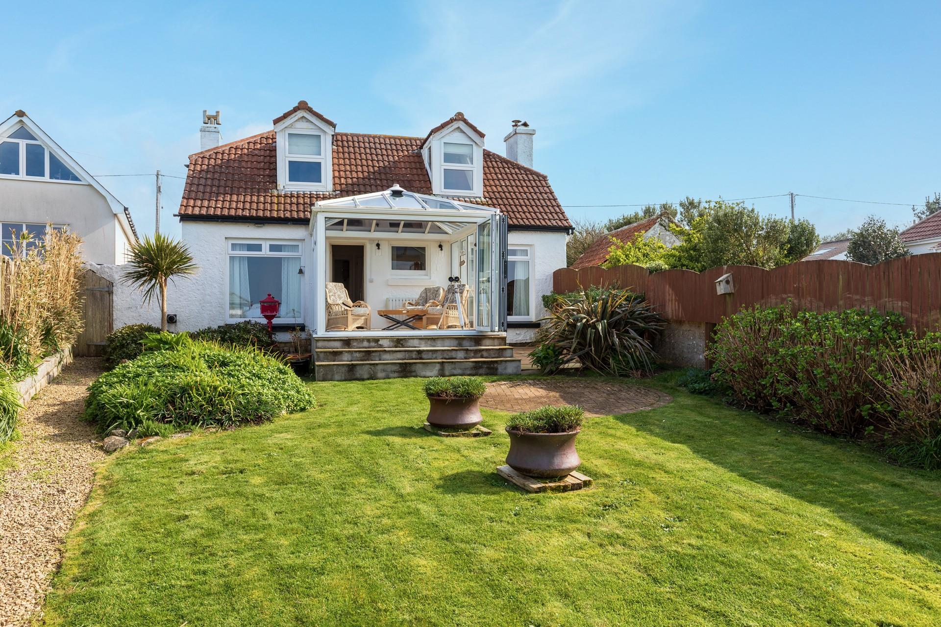 Soak up the sun in the garden with the views in front of you!