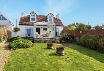 Soak up the sun in the garden with the views in front of you!