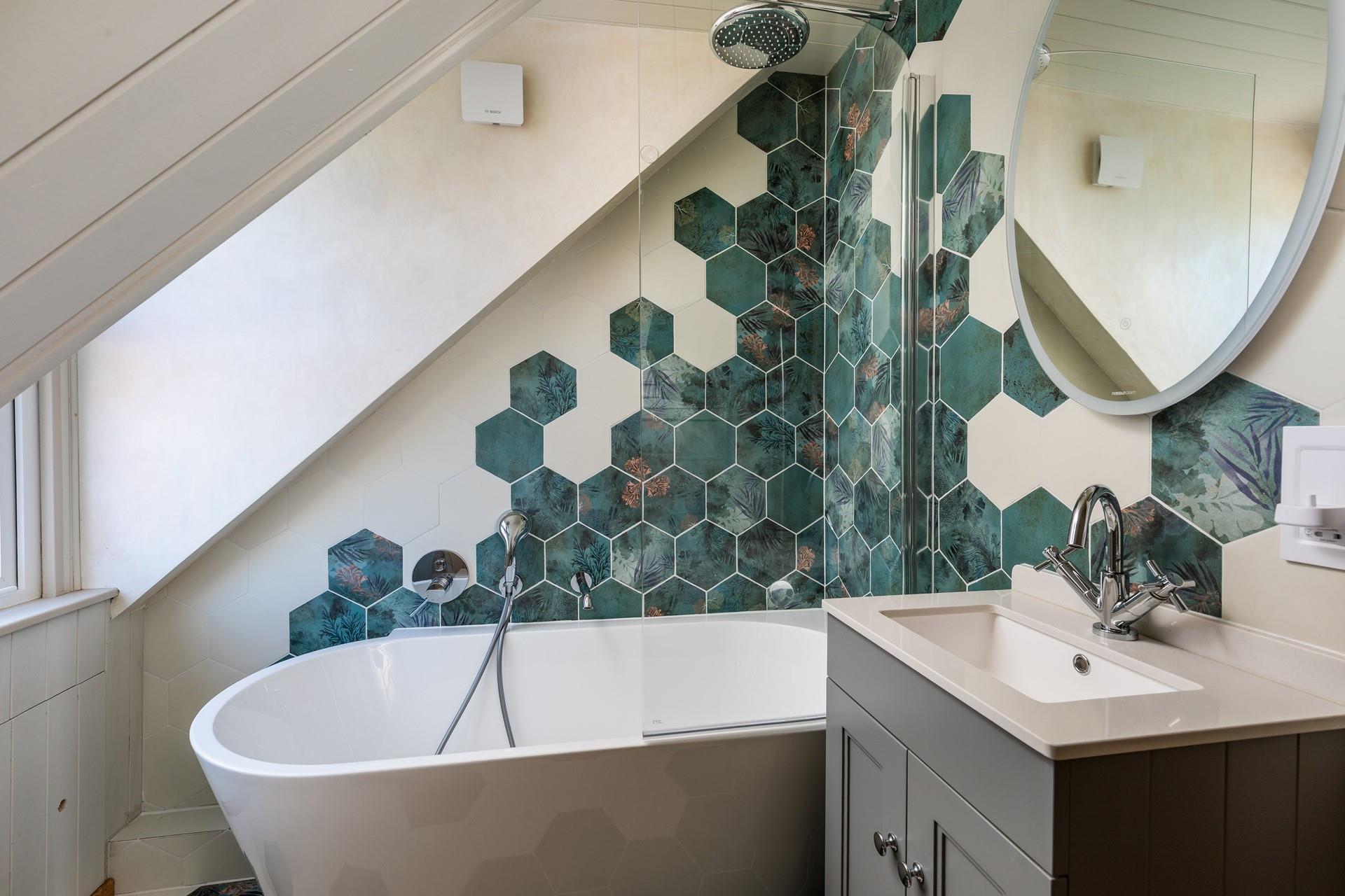 Sink into the tub in the family bathroom.