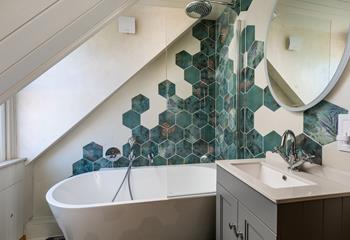 Sink into the tub in the family bathroom.