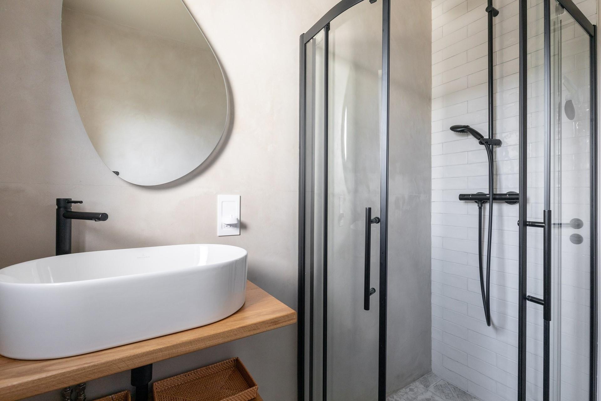 The downstairs shower room is modern and stylish.