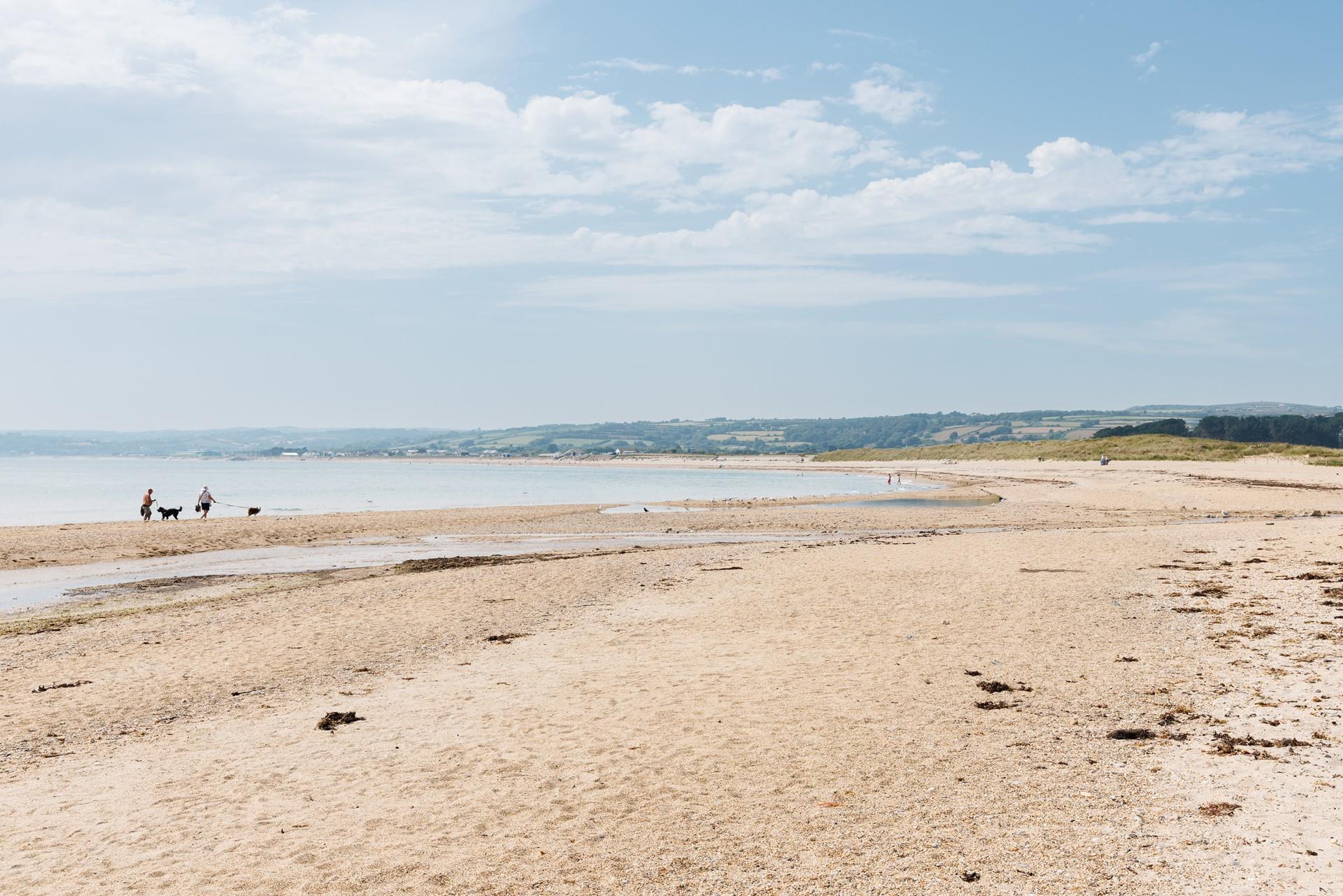 The beach is just a short stroll away, ready for days of sun, sand and sea.