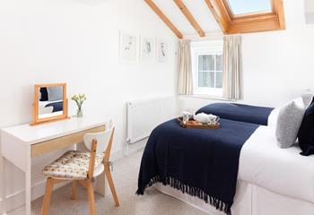 Twin beds or a king-size setup, this flexible room adapts to your stay.