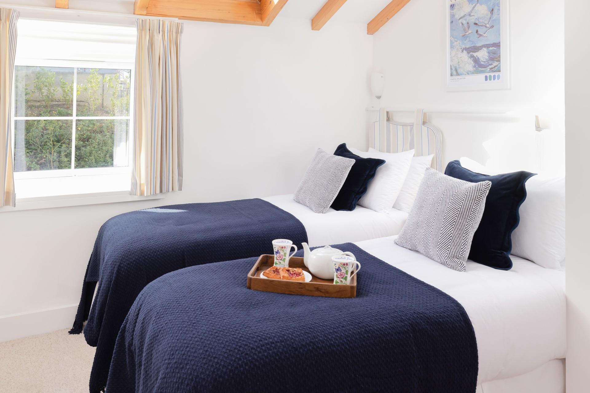 Snuggle into bed after a day spent exploring the coastline.