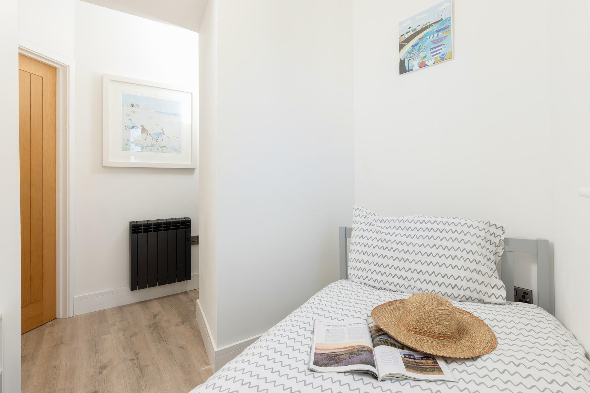 Bedroom 2 is a single bed, suitable for an adult or child.