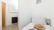 Bedroom 2 is a single bed, suitable for an adult or child.