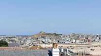Take in the picturesque view across the rooftops and out to sea!