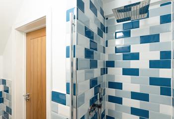 A luxurious rainfall shower offers a refreshing start to the day!
