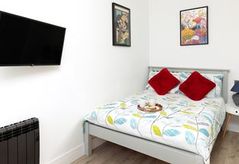 Bedroom 1 is a charming haven where you'll sleep well after days spent in the salty sea air.