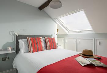 Sink into bed and unwind in the cosy bedroom. 