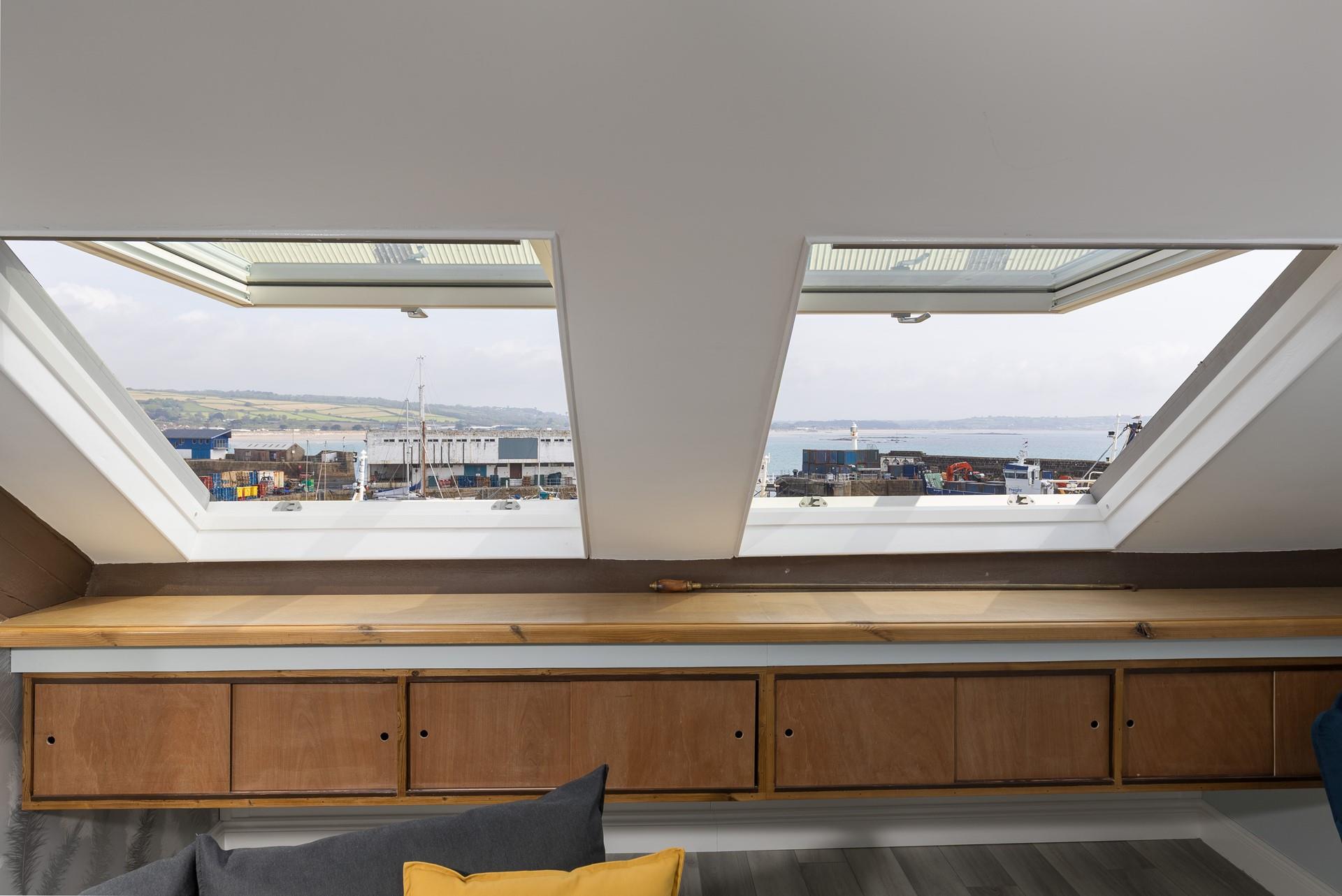 Open the windows and gaze out at the views over the harbour. 
