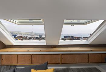 Open the windows and gaze out at the views over the harbour. 