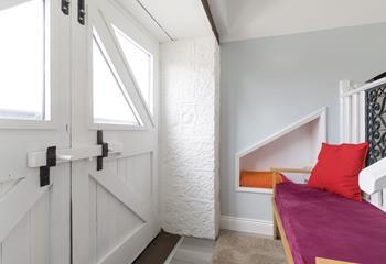 Relax and curl up with a good book on the cosy bench.