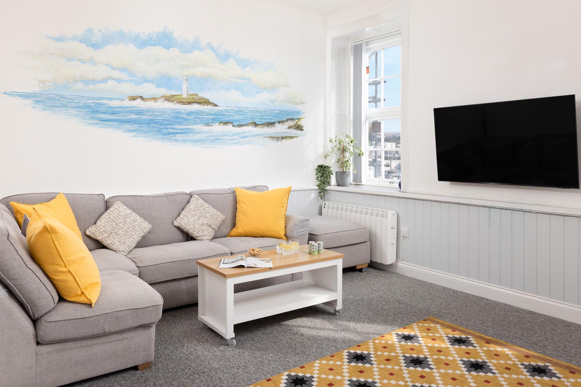 The cosy living area overlooks the harbour in Penzance.