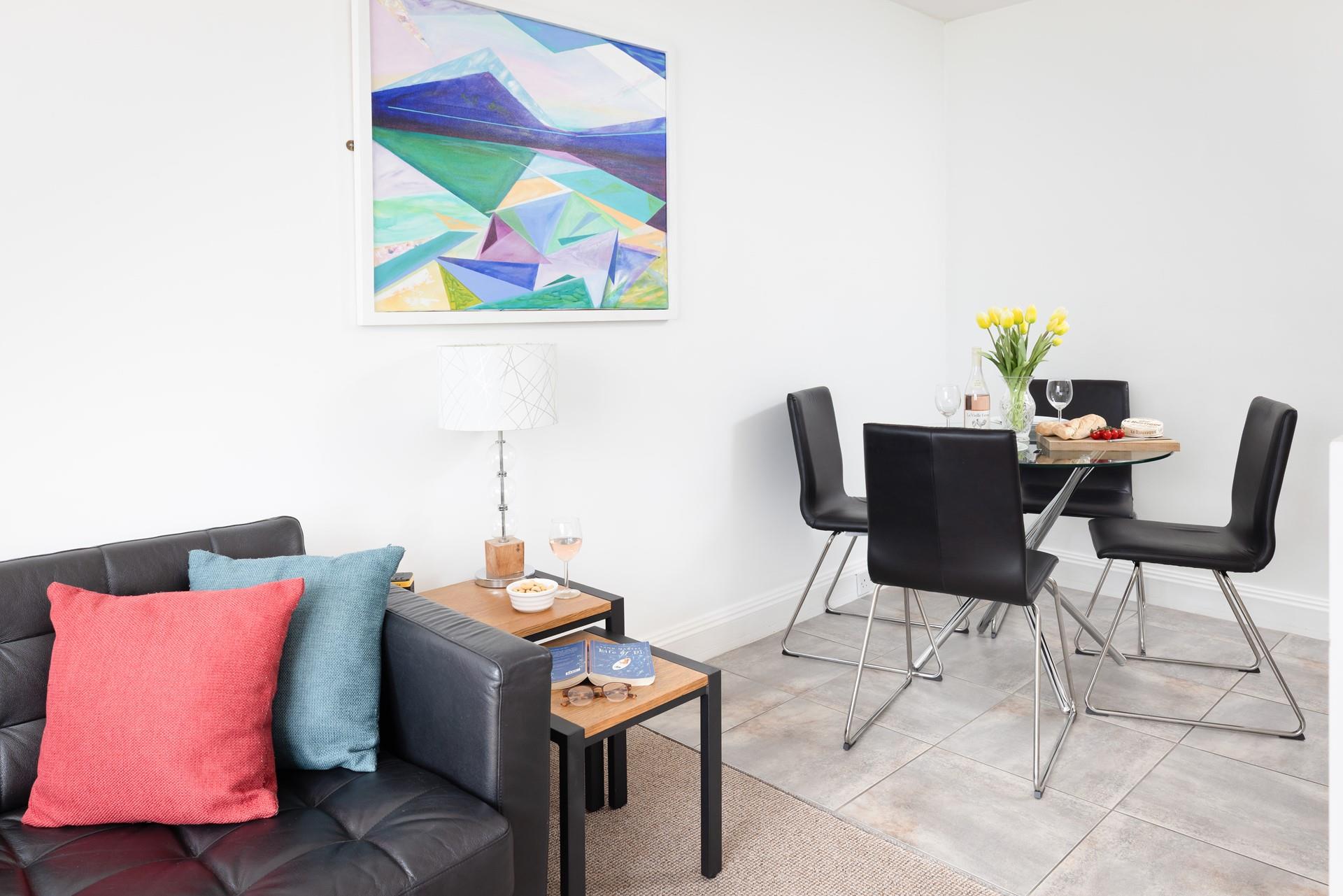 Abstract art and pops of colour create a welcoming space for all to enjoy.