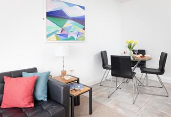 Abstract art and pops of colour create a welcoming space for all to enjoy.