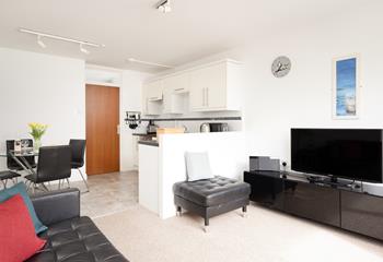 The living area and kitchen have all you need for a relaxing stay.