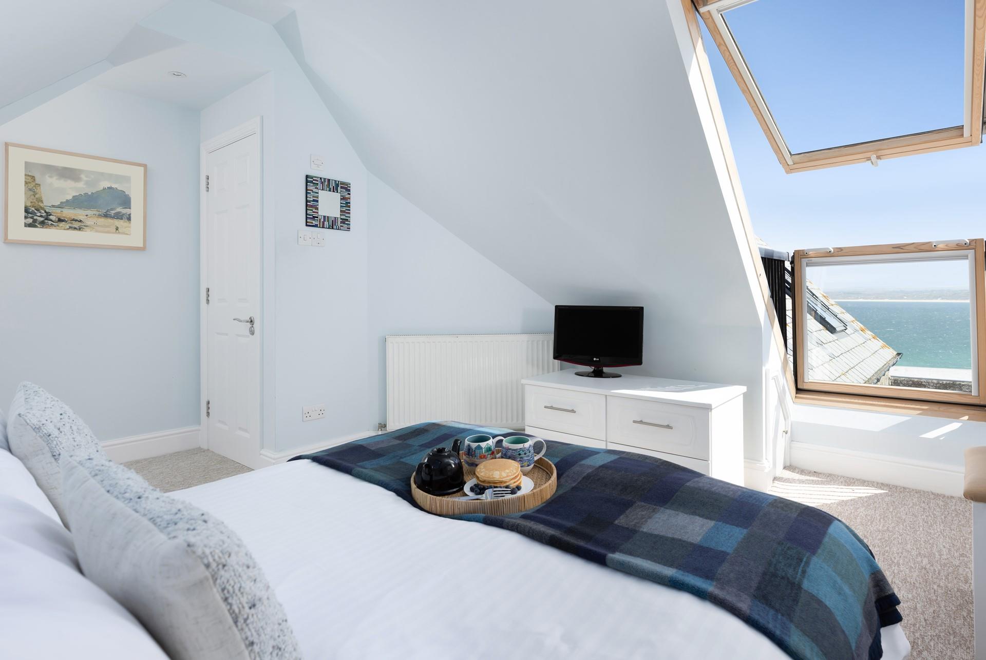 Wake up to the sights and sounds of the sea in bedroom 1. 