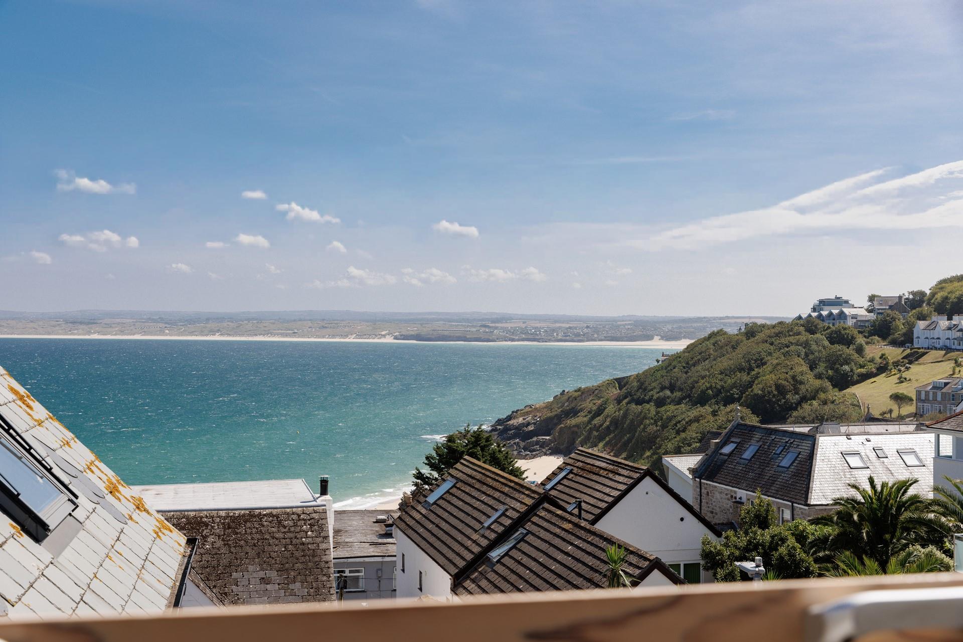 Gaze across the rooftops and out to sea, watching the ever-changing tide.