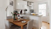 Enjoy a delicious meal around the dining table. 